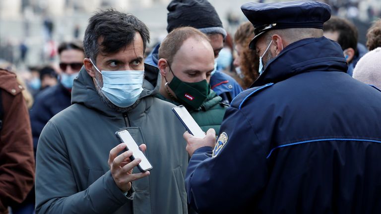 A visitor has their Green Pass checked at the entrance to the Roman Forum the day before health cards become compulsory on public transport, in Rome, Italy, December 5, 2021. REUTERS / Remo Casilli
