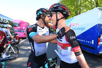 Australian Michael Matthews kisses Tadej Pogacar.